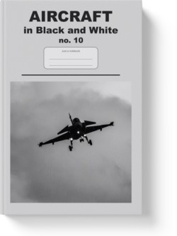 'Aircraft in Black and White No. 10' - a notebook or composition journal by Vlavoy. 'Go to Amazon' link.