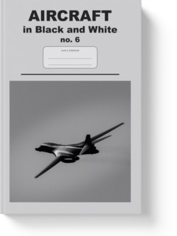 'Aircraft in black and white no. 6' - a notebook or composition journal by Vlavoy. 'Go to Amazon' link.